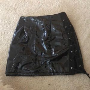 unworn glossy black skirt.